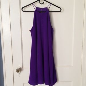 Purple sleeveless dress.